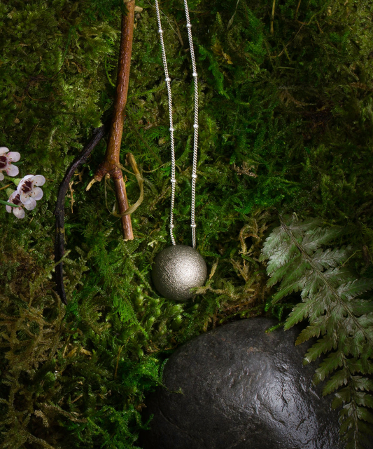 Nickel Alloy Soul Sphere Necklace on moss