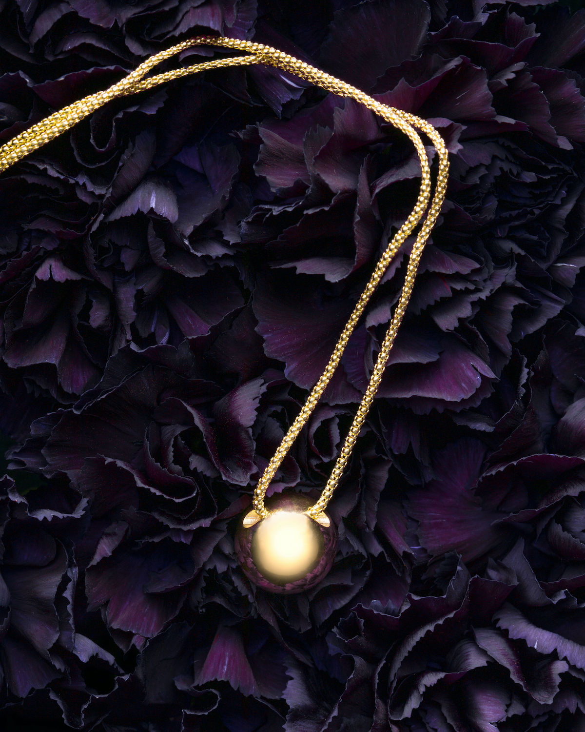 Solid 14k Gold Soul Sphere Necklace on carnations